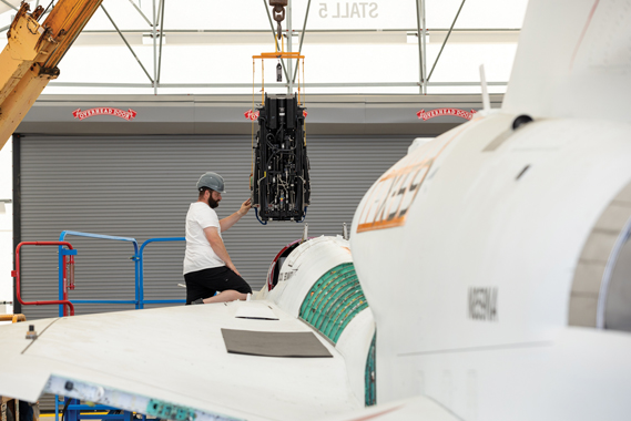 NASA Life Support Technician Mathew Sechler provides support as the X-59’s ejection seat is installed into the aircraft at Lockheed Martin Skunk Works’ facilities in Palmdale, Calif. Completion of the seat’s installation marks an integration milestone for the aircraft as it prepares for final ground tests. (Lockheed Martin photograph)