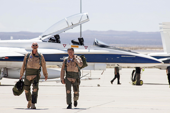 NASA pilots Nils Larson and Wayne Ringelberg head for a mission debrief after flying a NASA F/A-18 at Mach 1.38 to create sonic booms as part of the Sonic Booms in Atmospheric Turbulence flight series at NASA’s Armstrong Flight Research Center in California, to study sonic boom signatures with and without the element of atmospheric turbulence. (NASA photograph by Lauren Hughes)