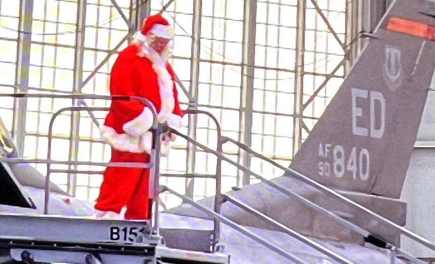 Santa arrives in F-16 (Courtesy photos Atherine Blanco Coffee4Vets)