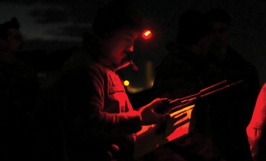 U.S. Air Force Staff Sgt. Michael Hollingsworth, 355th Operational Support Squadron air traffic control supervisor, reads over a checklist before taking control of air traffic operations at Davis-Monthan Air Force Base, Arizona, Jan. 16, 2025. Each ATC Airmen practiced relaying operations information to the landing aircraft to qualify for their training. (U.S. Air Force photo by Senior Airman Andrew Garavito)