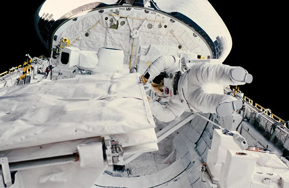 Astronaut Kathryn D. Sullivan checks the latch of the SIR-B antenna in the space shuttle Challenger’s open cargo bay during her historic extravehicular activity (EVA) on Oct. 11, 1984. Earlier, America’s first woman to perform an EVA and astronaut David C. Leestma, participated in an in-space simulation of refueling a spacecraft in orbit. (NASA photograph)