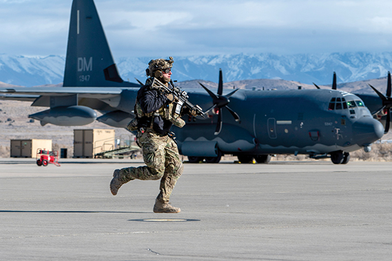 A U.S. Airman runs toward simulated gunfire during Mosaic Lightning 25-01 in Utah, Feb. 6, 2025. ML 25-01 tested the 355th Wing’s capability to deploy at a moment’s notice and operate effectively in an unfamiliar austere environment while facing simulated threats like missile strikes and attacks from opposing forces. (U.S. Air Force photo by Senior Airman Devlin Bishop)