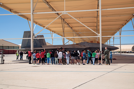 STARBASE students get up close and personal with F-22s during a tour during the fall 2024 semester. (Air Force photographs)